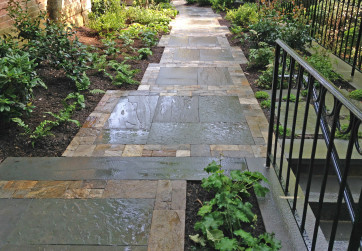 Rich warm colors frame stone panels on this shady side path