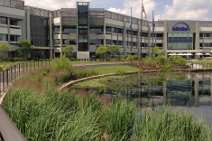 View from exercise trail across pond toward headquarters building
