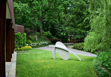 Sculpture is positioned in a front lawn panel to capture guests attention upon arrival