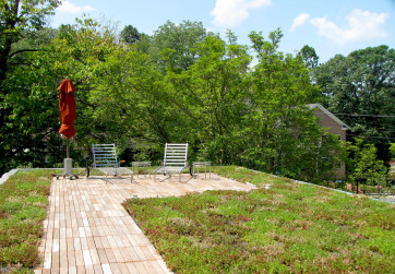 A green roof provides an usual urban oasis for the homeowners of this zero net energy LEED Platinum property